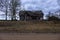 old countryside barn from wooden planks and concrete in rural area