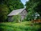 old countryside barn from wooden planks and concrete in rural area