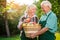 Old couple and apple basket.