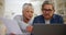 Old couple, laptop and paperwork, bills and taxes online with budget, life insurance and retirement fund. People at home