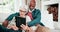 Old couple on sofa with tablet, smile and relax with love, interracial marriage and bonding in home. Social media meme