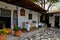 Old courtyard with a table, chairs, icons at the church