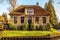 Old cozy house with thatched roof in Giethoorn, Netherlands