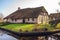Old cozy house with thatched roof in Giethoorn, Netherlands
