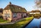 Old cozy house with thatched roof in Giethoorn, Netherlands