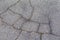 Old and cracked road surfaces are used to create the background and design. Deep relief Cracks on the pavement. Worn road, very