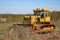 Old crawler tractor in the field