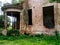 Old crumbling brick house in ruins