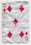 Old crumpled five of diamonds playing card