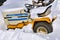 Old Cub Cadet tractor buried in the snow