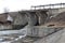 The old dam of the Siberian village of Verkh-Tula passes the water drains the spring flood