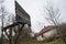 Old damaged basketball board in front of vintage abandoned house in the countryside