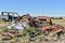 Old damaged cars in the junkyard. Car graveyard