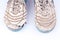 Old damaged futsal sports shoes on white background isolated close up