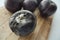 old damaged plums on a table