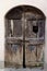 Old damaged wooden locked door