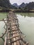 Old dangerous abandonned bamboo bridge crossing a river in the  Trung Khan District, Cao Bang Province, Vietnam