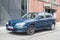 Old dark blue Nissan Almera hatchback car parked