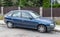 Old dark blue Opel Astra hatchback car parked