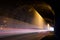 Old dark damp tunnel with light trails.