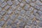 Old dark granite stone floor pattern as background in Italy