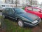 Old dark green Citroen XM limousine car parked