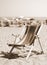 Old deck on beach with many umbrellas in summer