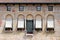 Old decorated facade with frescoes in Italy