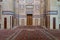 Old decorated stone wall, marble decorations and arabesque decorated wooden door, al Refai Mosque