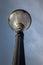 Old decorative streetlamp standing below the sky