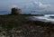 Old defense tower, low tide and ships