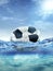 old deflated soccer ball floating in the ocean