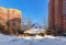 Old delapidated house in front of new residential houses. Balashikha, Moscow region, Russia