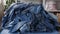 Old denim jeans, textile waste, Denim fabric. Recycling denim clothing. Cotton-based clothing, such as denim, makes up a