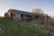 Old derelict farm building barn in remote rural setting