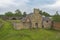 Old derelict mill building in rural countryside setting