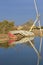 Old derelict sailing boat on river bank