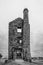 Old derelict tin mine engine house - black and white - in the Minions, Bodmin Moor, Cornwall, UK