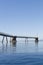 Old derelict wooden jetty pier in sea at Inverkip power station