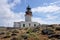 Old deserted lighthouse on greek island Mykonos