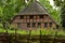 An old desolate and abandoned farmhouse lies vacant and looks like a haunting house.