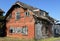 Old desolate red brick house, ruin and out of use architecture