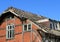 Old desolate red brick house, ruin and out of use architecture