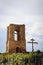 An old destroyed church and a wooden cross. Beautiful background