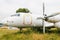 Old destroyed dismantled and abandoned aircraft in the field. Plane crash.