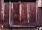 Old detailed aged vintage rusty corrugated red brown textured zinc alloy metal sheet exterior fence used in construction industry