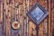 Old Diamond Shaped Barn Window and Rusted Tire Rim