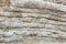 Old different layers stone rock formation background