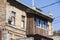 Old dilapidated balcony in an old residential building, closeup