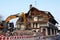 An old dilapidated house is torn down with an excavator